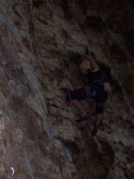 Travis in the upper difficulties on the Bolt Route.