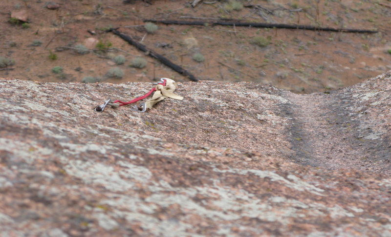 The rap anchors on the north summit.