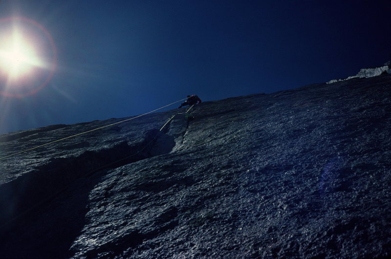 Chip Ruckgaber leading the crux pitch of D7.<br>
July 87