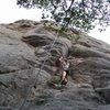 Jenny At the Small overhang with what I think may be the first bolt right above her head.