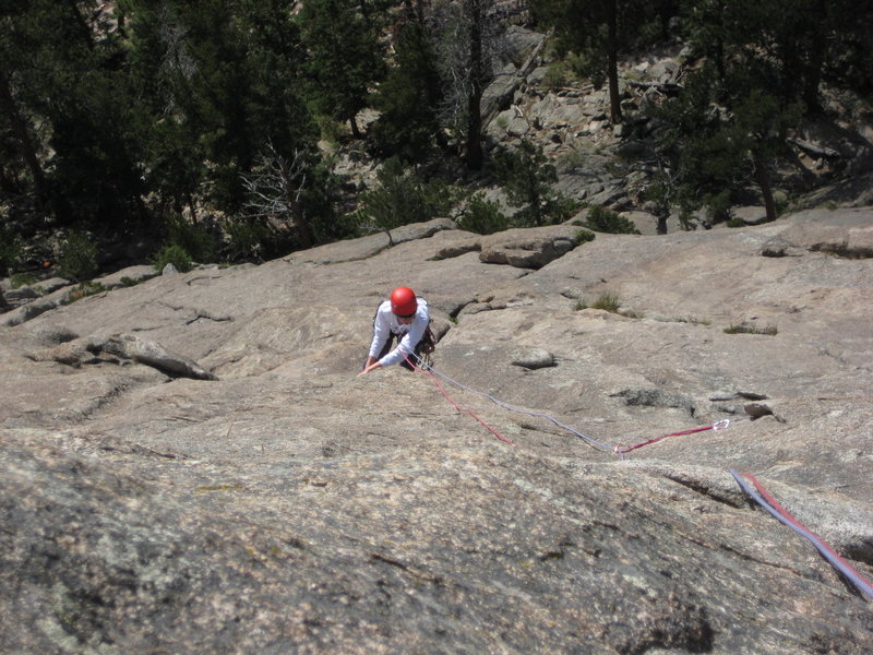 P3: Kody pulling up on the knob above the optional walk-off ledge. Rope line is very climbable at 7+. Pro attached to red sling is on the WW line.