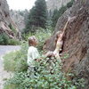 Maya Girl sending her first outdoor boulder problem (V0), being spotted by climbing legend Jimmy Dunn.