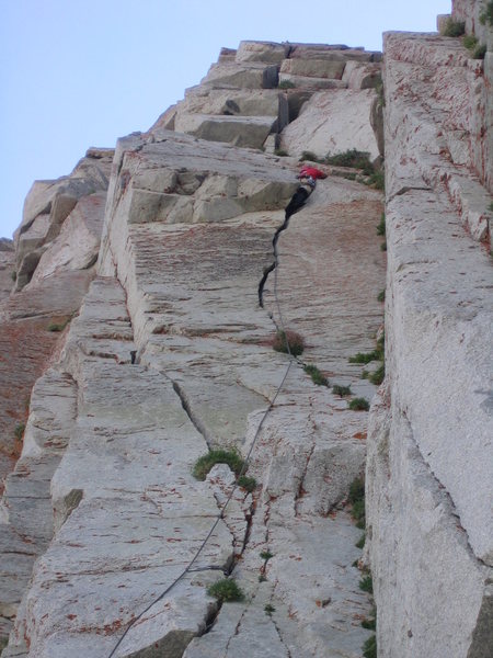 Tyler in the maw, wondering how this route only gets one star in the guidebook...  (the alcove belay is visible just under the shaded triangular roof)