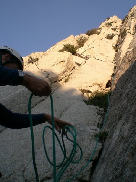 Starting Pitch 1 in the large right facing corner after spending the night on the bivy ledge at the top of the gully.