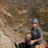 Patty Fienup relaxes on "Lunch Ledge," midway up the Central Gully of the Fortress, with Pine Mountain in the background.