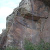 Cat's Eye Face with Lynn Hill Roof and Upper Roof showing.  Face route traverses thin crack to left of roof.  Gaston w/ right, crimp left, hook right foot around nose, campus up the nose for Lynn Hill's route.  Top Roof follow crack to the right of Cat's Eye or flake way right, then follow crack at base of roof to left.