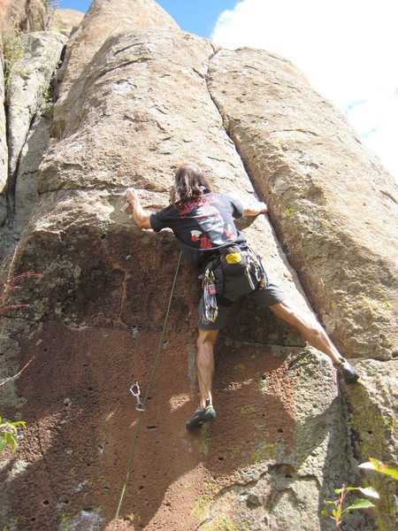 Just through the crux (after dogging!).  Hard pocket sequence with very thin feet through the steep red wall.