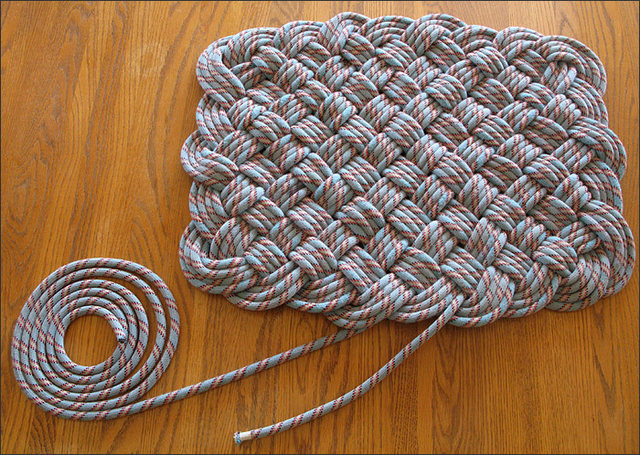 Done weaving!  This photo show how much of the 60m rope is left after doing a quadruple weave.  The dimensions of the finished rug is 2 1/3' x 1 3/4'.