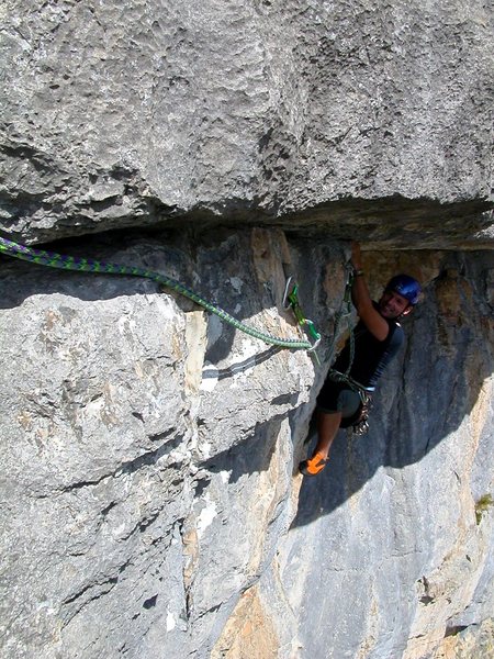 Pitch six: Daniele H hand traversing his way out from under the roof.