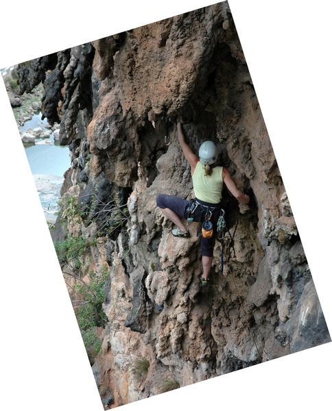 Climbing on a free-hanging stalactite, Cobra, Weeping Wall.