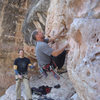 First ascent of Bluto Tastes An Olive. Erik Wolfe climbing