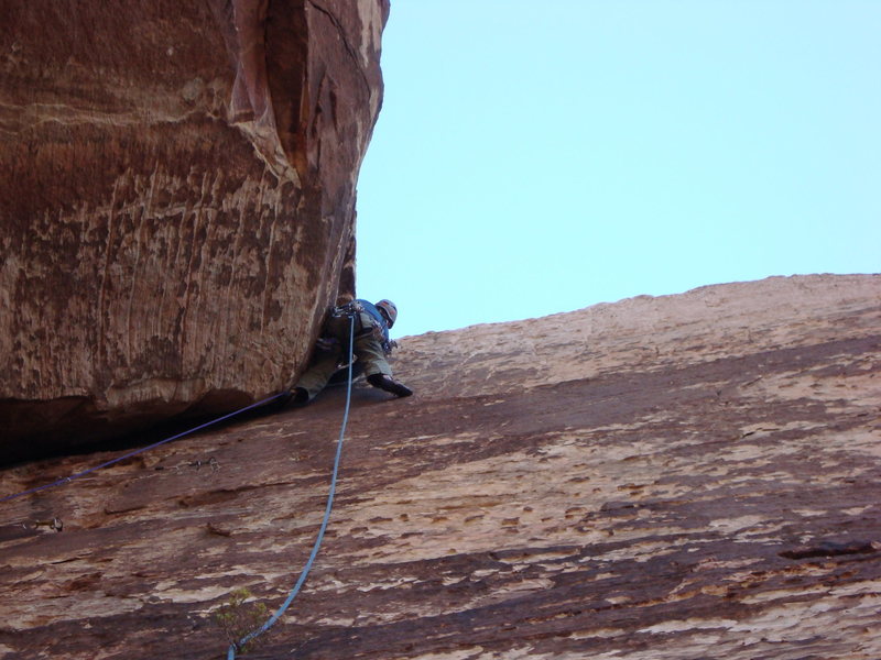 Brett working the crux and gaining the corner, thanks to fist jams and placing the #4 Camalot for protection. 