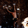 Brad Smith at 3rd annual Phoenix Bouldering contest on main Bolus wall near the house (up hill side). Notice the tape eliminates. Bandana head on right is Jeff McQueen.