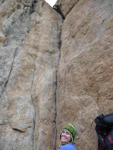 Kelly Parnigoni belaying John Parnigoni as he wends his way up the second half of Wolf's Tooth.
