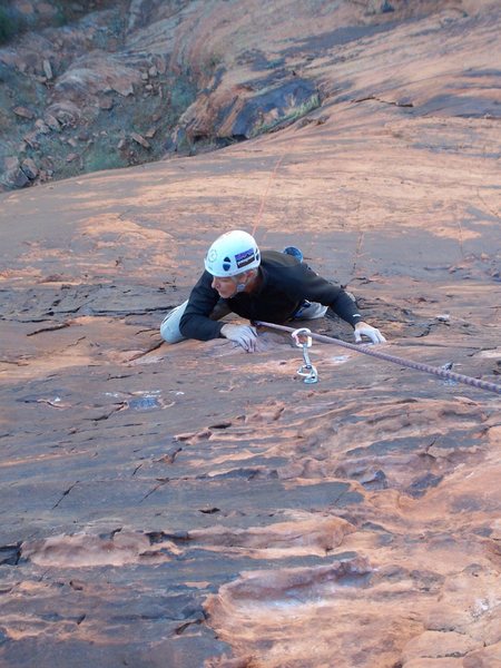 Joe working out the reachy crux moves on P2.