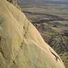 Climber near the top of Absinthe - taken from the top of Too Tough to Die.