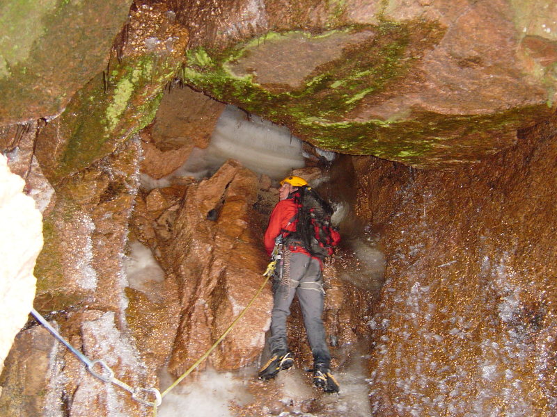 Erik Wellborn checking out the rather rainy 2nd pitch of Blind Assumption. some time back in '06.  Photo by Trask Bradbury.