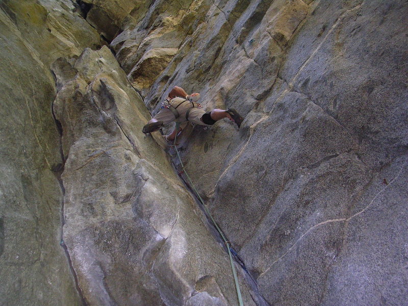 Starting the thin fingers and stemming crux on Gold Dust. Easy hike, nice belay zone, good pro, shady, and steep!   