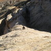 Ben Leaving the steep canyon side of pitch three and climbing the 5.5 run out section of Slip Not. photo Paul Ross