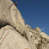 Lance climbing the crux section on the FFA of the Lateral Fin.