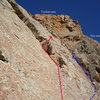 Pay attention here! We opted for the route in red after the "3rd class" ramp at pitch 7 1/2, but should have traversed left towards the arete (blue line), where the arch was. The red arrow indicates where the double bolt belay station is. The last pitch, with a few bolts and fun 5.8-5.9 mantles/smears beckon.