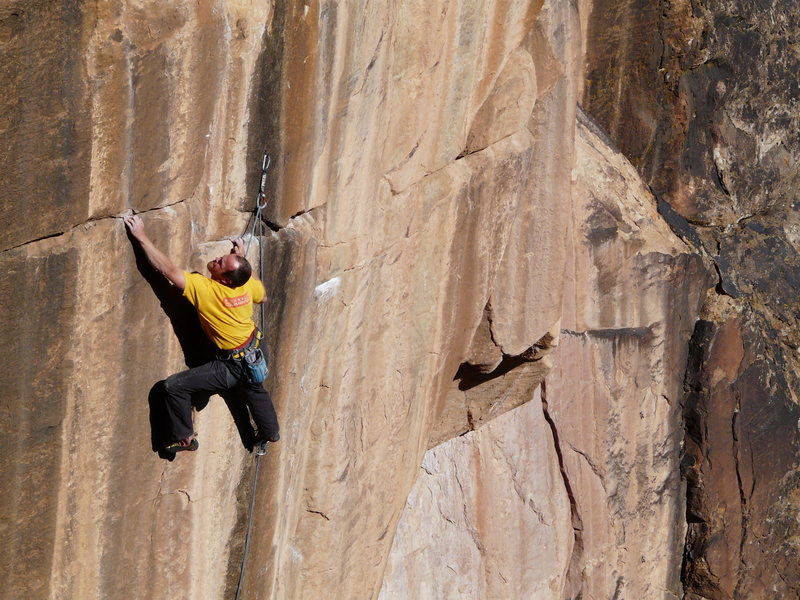 The final redpoint crux is controlling this hold and the stand up, shown in the next frame.