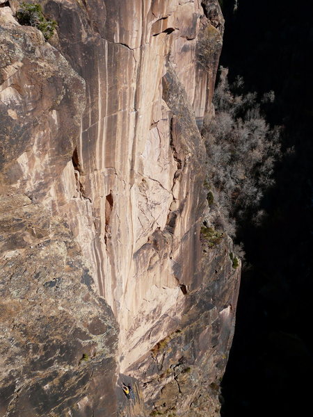 The line takes the beautiful black streak up this gently overhanging wall.  It was equipped by Mark Howe a few years ago; he later graciously opened up the project.  The beauty of the line and the area are matched by the movement -- it is flawless for the entirety of it's 130' length.  After some pretty epic belay sessions (thanks Ben & Amanda), it finally went down:  The Paper Crane, 5.13a.<br>
