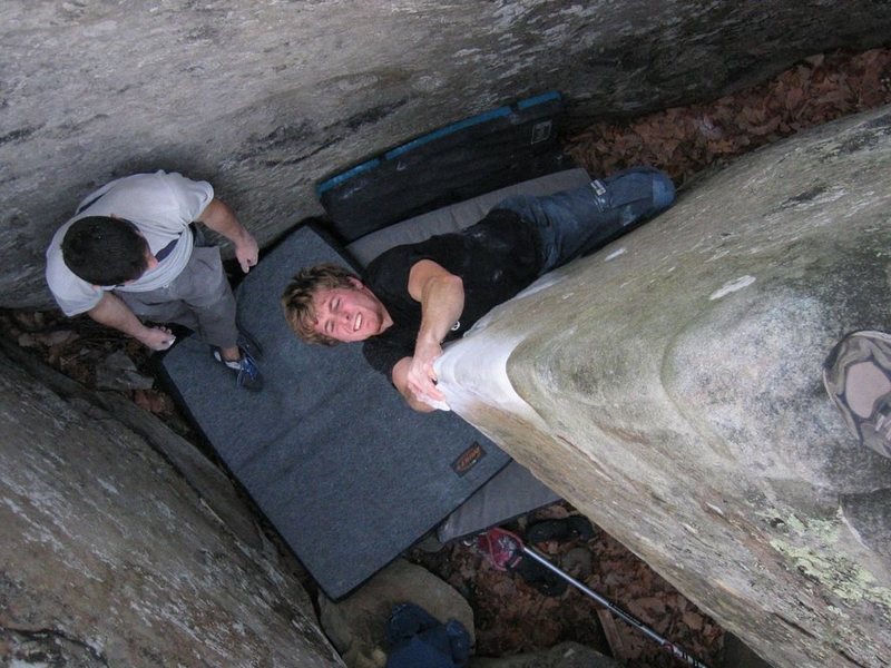 Luke tries to squeeze his way up this beautiful arete.