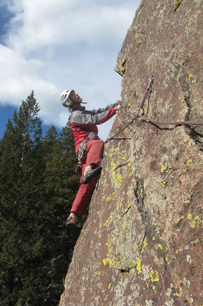 At the end of the leftwards traverse, looking up at the second bolt. Photo by Ken Parker.