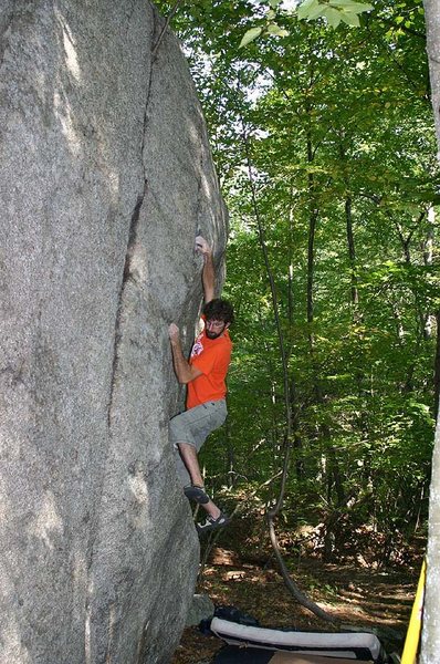 Brian Cowles on a V5 on the Train Tracks boulder.