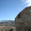 Climbing the easy upper slab of Problem A