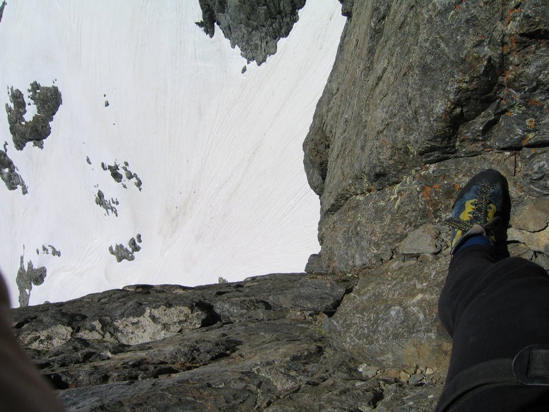 A few pitches up on Clyde Minaret, looking down into the snow field below...