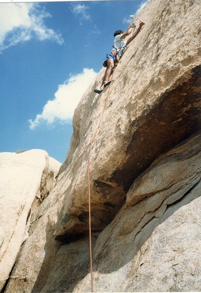 Rob Mulligan placing the second and last bolt on the FA of "Hallow Friction 5.10c".