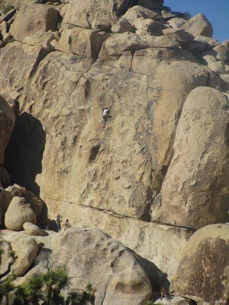 Climber on Flake and Bake, with an uninterested girl below.