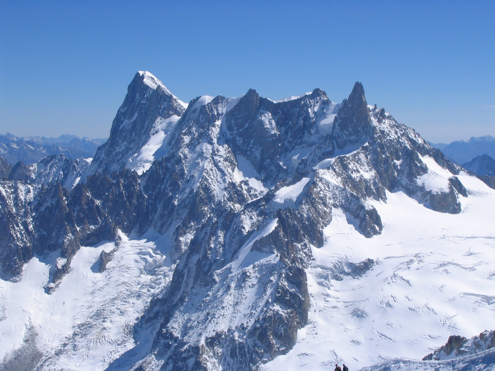 Grandes Jorasses. The Walker Spur is the steep face on the left skyline. The  right-most spire is the Dent du Geant.