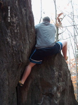 This is a photo of me doing my first boulder problem in fall 2006...