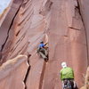 I just traversed from the wide crack to the thin crack (crux).    The piece to my left is a very tipped out old #5 camalot.  A #6 would have been much better.  Also, you can climb straight up to this spot @ 12-.