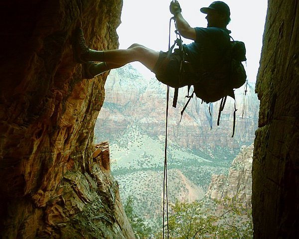 Rappelling short 5th class chimney on long hiking route to Hidden Arch (above Watchman campground.)