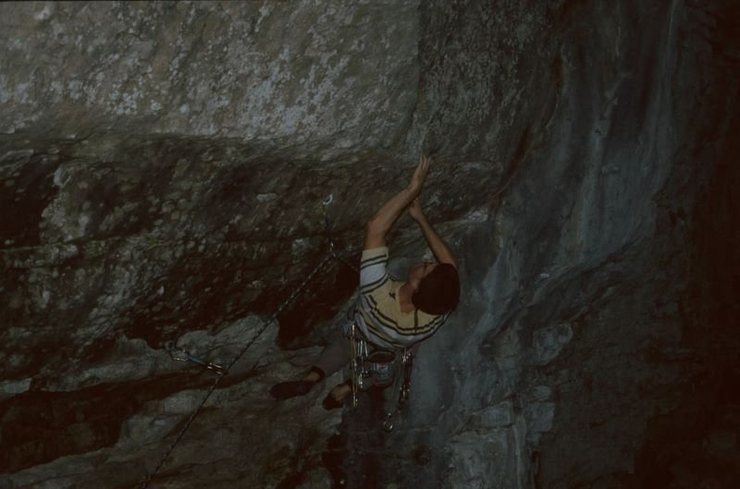 A crux move on Reanimator.  The wall is very steep and you have to roll up on a very shallow pocket.