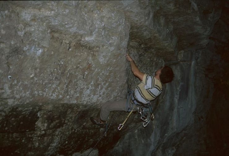 A second crux move on Reanimator: throwing from bad pockets to a reasonable ledge in the tier above the bolt.