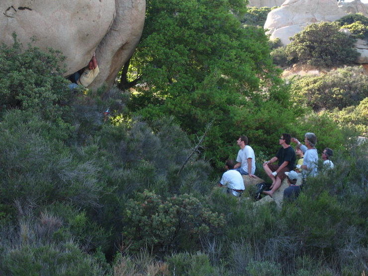 Greg Cameron, in the light blue long sleeve, (aka Eeyonkee, Grug), Poway Mountaineer extraordinaire, giving beta away to Levy from 20', since he has "Greg's Climb" dialed (the climb is also known as "Cricket"), during the Mt. Woodson Shindig reunion in June, 2007.