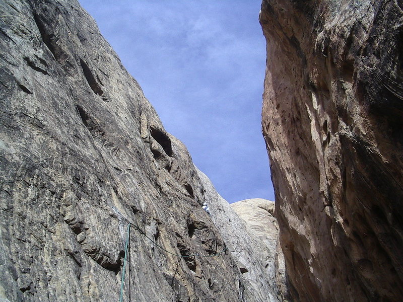 About to lower back into the slot.P2 A direct escape could be made up the difficult looking steep slab above ,but more pro bolts than we carry would be needed.Photo Pat Moe