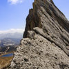 Climber on 'the wave' feature of Matthes Crest