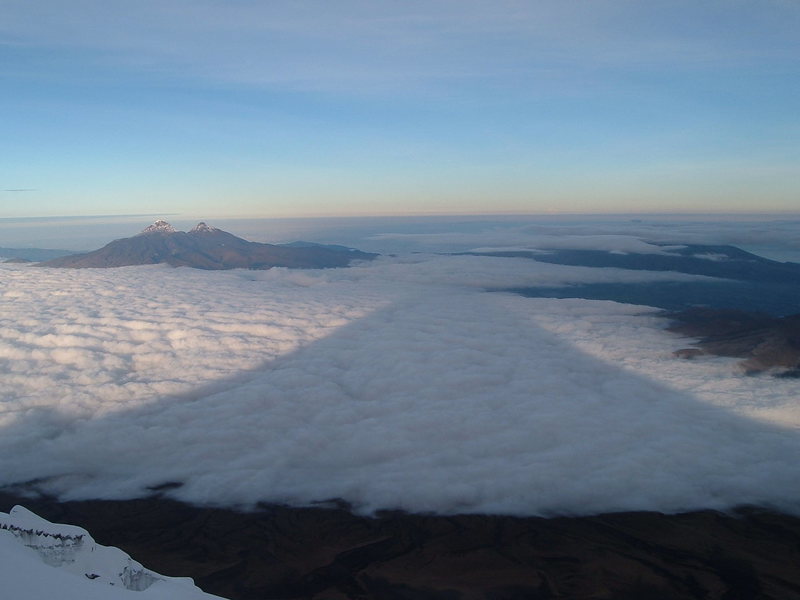 Shadow of Cotopaxi from the regular route, an enjoyable, scenic climb. Illinizas in background.