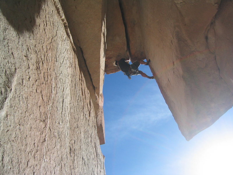 Friend, Eric, pulling through the wide roof.  What a great route - can't wait to lead it next time!