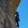 Beginning of the crux pitch on The International, Glenwood Canyon. Chris is shown here climbing the totally hollow and precarious flake below the roof.