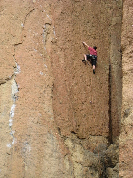 This pic shows the location of the first two bolts and the ledge (the black boulder below and slightly right of the first bolt).