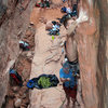 throwing the only difficult move of the climb--from the overhanging face to a big jug around the right side.  Crude Control in the Black Corridor at Red Rocks