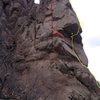 The yellow line shows the Nose, with the belay above the roof.  The red line shows Alabama Crack with the belay on the arete.  There are large loose blocks just below the last fixed piton near the top of Alabama.  Hope this helps!