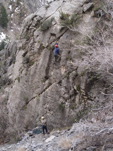 Reaching for the jug.<br>
<br>
The three bolts are 6-7 feet part, then it's 10 ft to the chains (don't fall clipping).